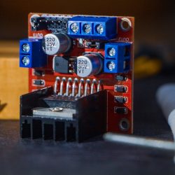 Detailed view of a robotics component with capacitors and connections, captured in Dhaka, Bangladesh.